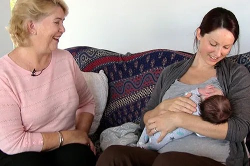 Dr Robyn Thompson with a mother and her baby