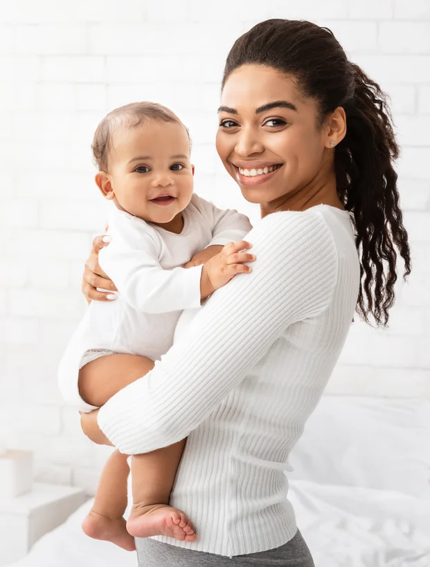 A mother holding her baby